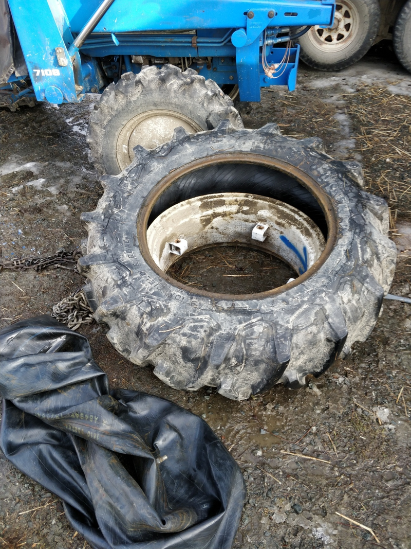 patience and a lot of pry-walking with multiple bars and it eventually comes off... pull off the old inner tube and get that busted old tire off the rim entirely.